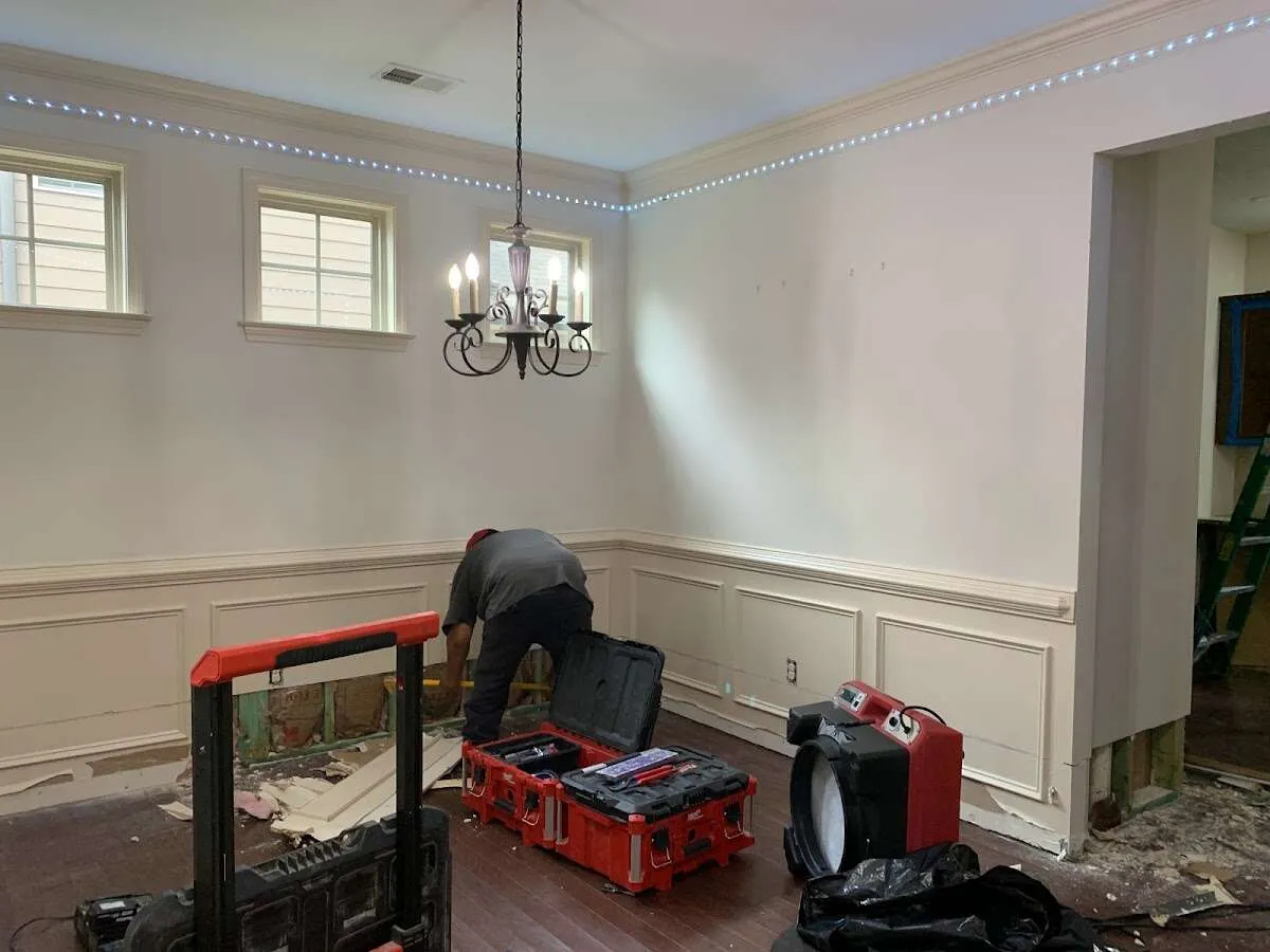 Restoration technician with professional equipment in Middletown